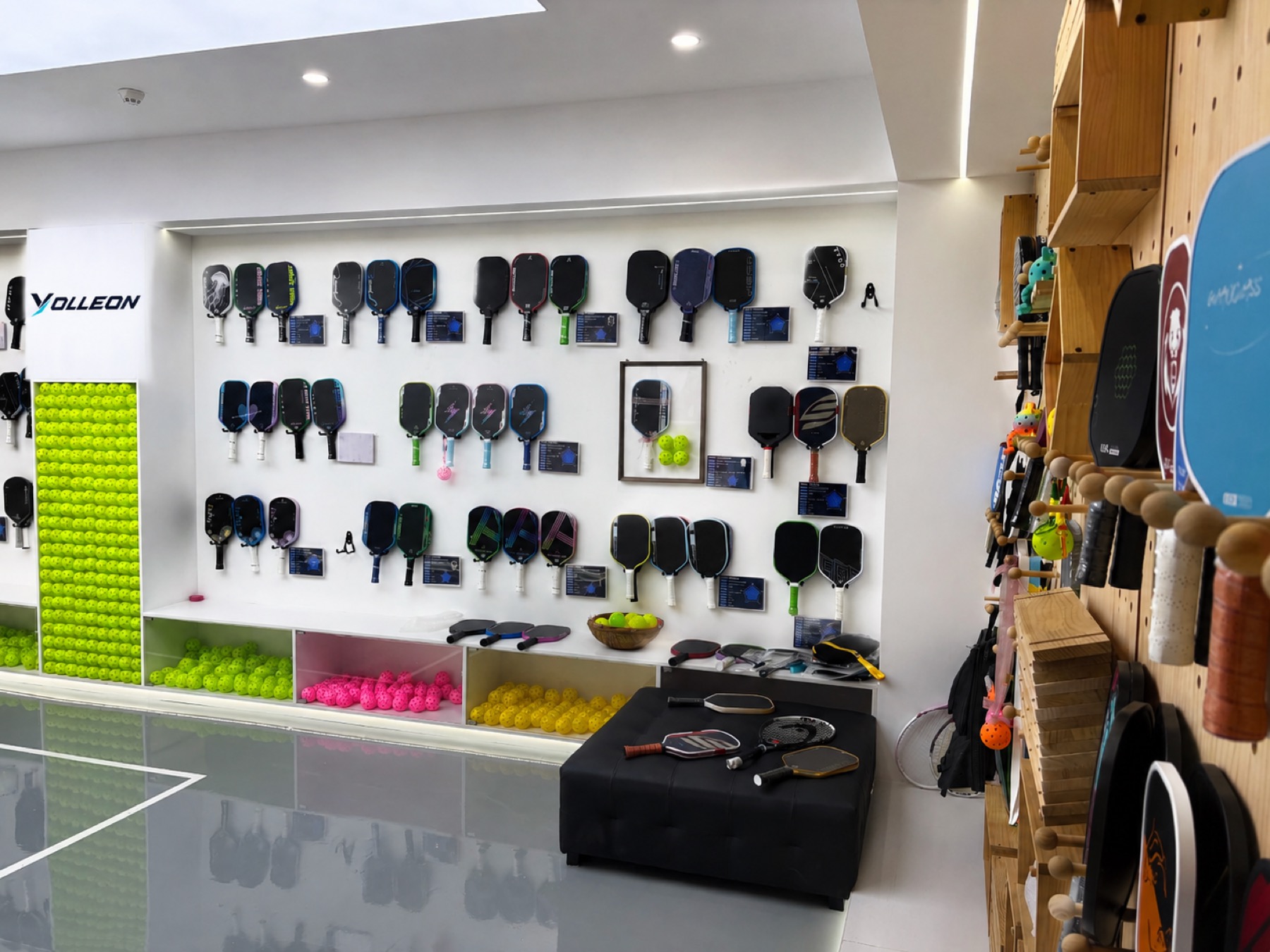 Volleon pickleball showroom displaying paddles, balls, and product samples