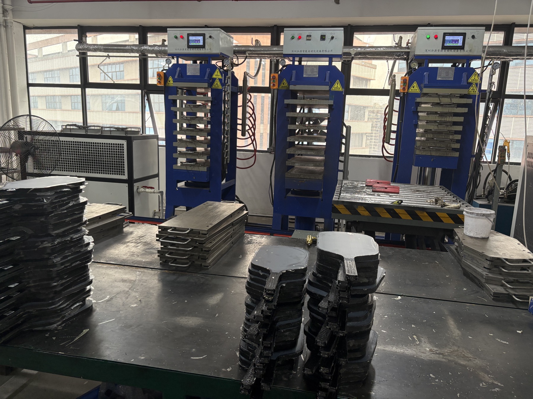 Thermoforming press equipment for pickleball paddle production at Volleon